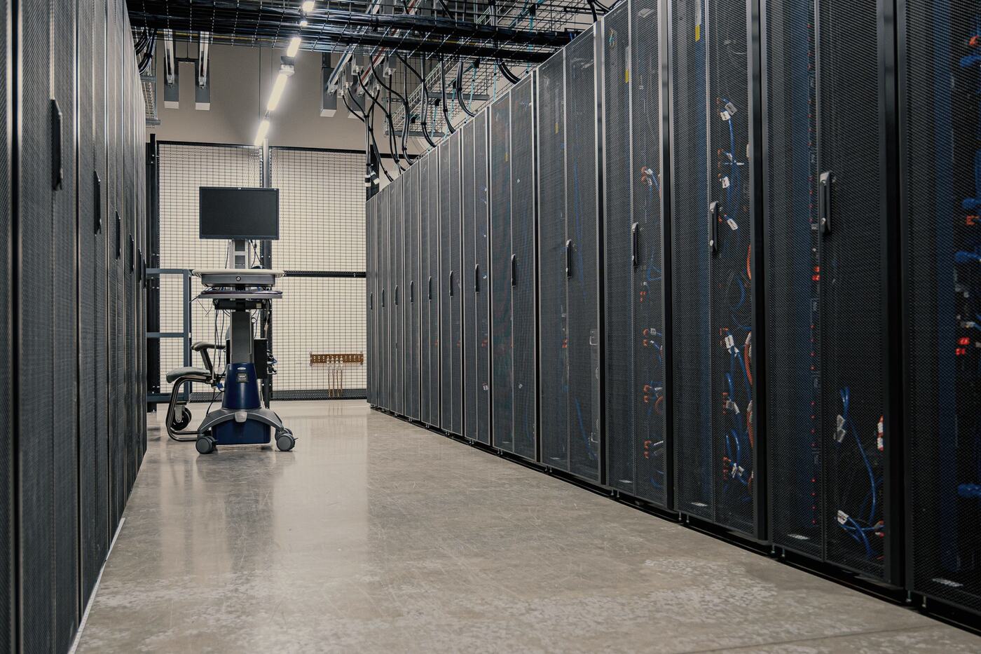 Rows of server racks in a data centre aisle